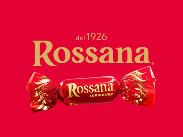 Caramelle Rossana l’Originale avvolte in carta stagnola rossa e dorata, con il nome del marchio e la scritta 